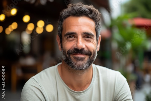 Portrait of handsome bearded man with beard looking at camera and smiling