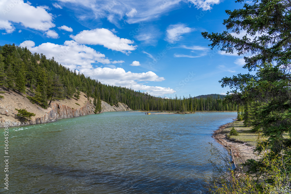 Canadian Rockies Jasper National Park landscape background. Athabasca River in summer. Alberta, Canada.