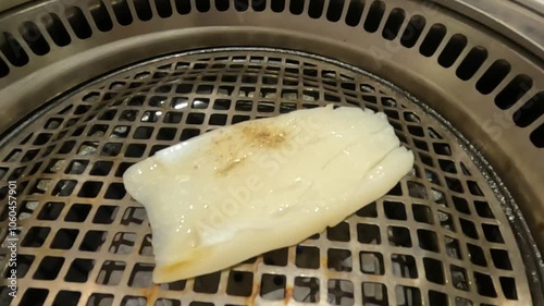 close up of sliced squid fillet in the grill