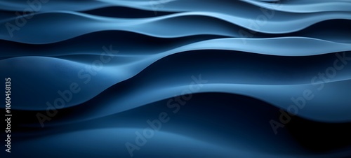 A close-up shot of smooth, undulating waves in deep blue hues, creating a serene and calming atmosphere that evokes feelings of tranquility and depth.