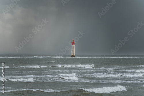 Chauveau lighthouse in the sea during windstorm on a stormy sky photo