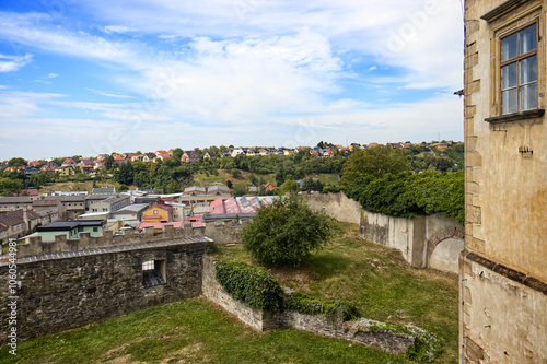 view of the old small town. Family houses in nature. View from the lookout point of the castle. Nature, village, sky with clouds. photo