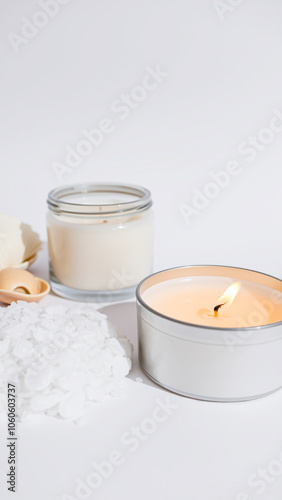 lit candle with unlit candles wax flakes