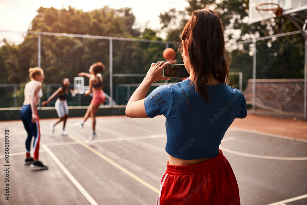 Obraz premium Picture, friends and woman with basketball court, health and practice with training, memory and network. Group, sports and team with game, smartphone and digital app for video recording and fitness