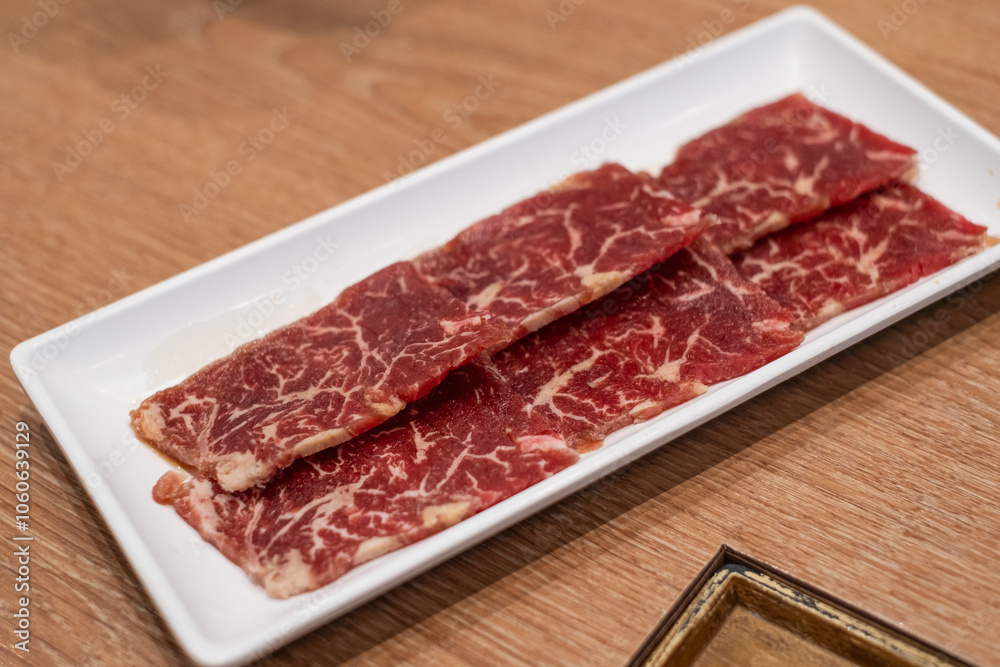 Delicious fresh raw juicy kobe wagyu marbled beef pork meat slice on plate ingredient for food sukiyaki yakiniku steak healthy meal Japanese traditional dining culture restaurant high protein bar-b-q Delicious fresh raw juicy kobe wagyu marbled beef pork meat slice on plate ingredient for food sukiyaki yakiniku steak healthy meal Japanese traditional dining culture restaurant high protein bar-b-q