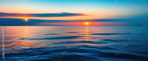 Serene ocean sunset, vibrant orange and blue horizon, smooth wave patterns, abstract seascape, long exposure photography, panoramic view, tranquil waters, ethereal atmosphere, minimalist composition, 