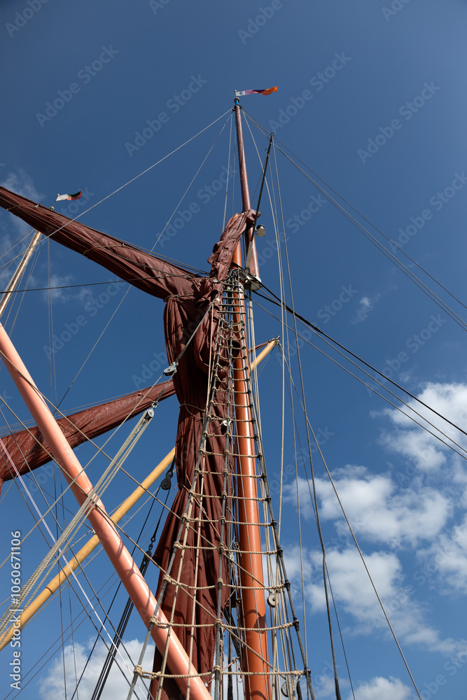 Masts and rigging on a Thames sailing barge for use as a background texture Masts and rigging on a Thames sailing barge for use as a background texture