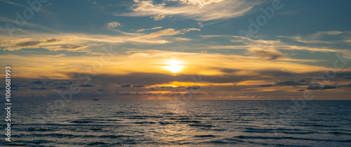 Cloudy sky on sea sunset, sunrise on ocean beach. Sunset landscape in the sky after sunset. Sunrise with clouds of different colors against the sky and sea.