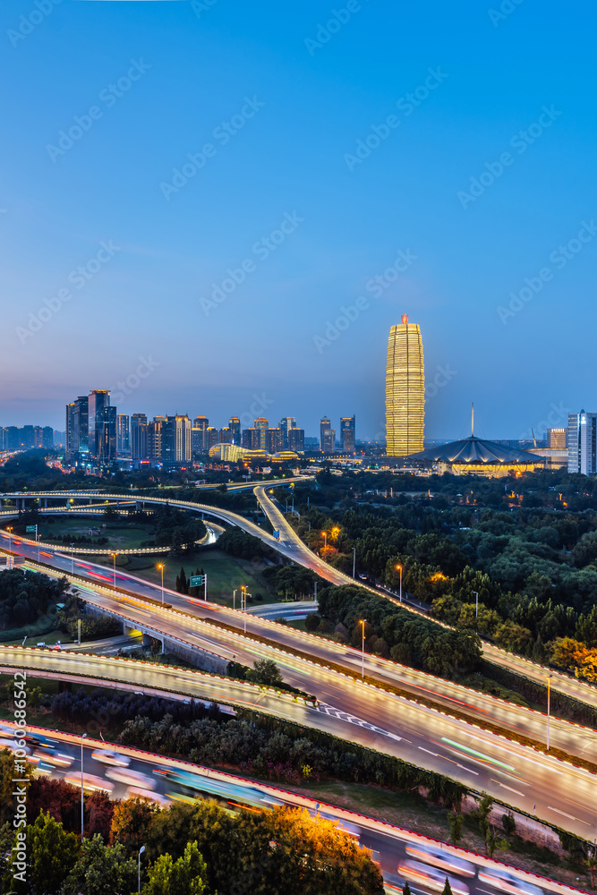 Naklejka premium Night view of CBD and overpass in Zhengdong New District, Zhengzhou, Henan Province, China