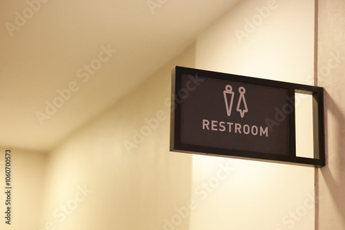 The restroom sign is mounted on the wall. Signs of male and female restrooms are installed for users to see clearly.