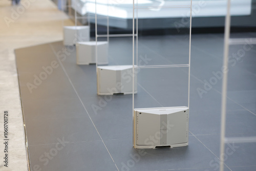 Anti-theft alarm poles are installed at the entrances and exits of stores. Anti-theft devices are designed to look modern.