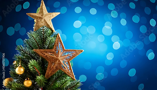 merry christmas decorated tree featuring ornaments like star blue background bokeh effect festive atmosphere photo