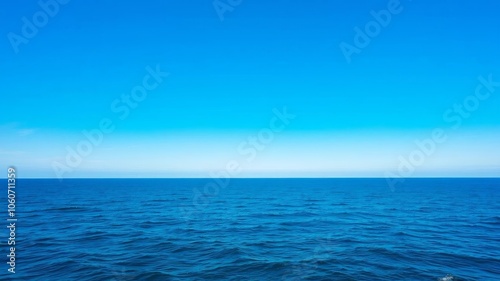 Wallpaper Mural A serene photograph of the vast ocean under a clear blue sky, showcasing the beauty and tranquility of the sea, blue sky, tranquil Torontodigital.ca
