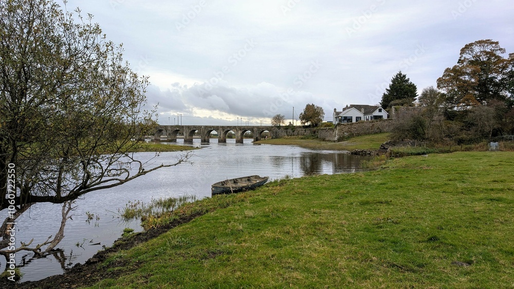 Old wooden fishing boat in river Shannon at Shannonbridge, Offaly, Ireland, nature background