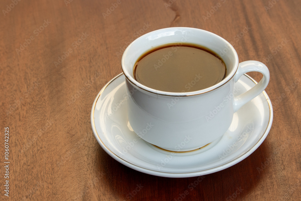 Black Coffee in Ceramic Cup on Wooden Table Black Coffee in Ceramic Cup on Wooden Table