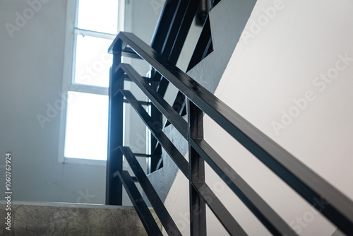 Schilderij op canvas Close-up at stairway iron handrail banister of the high rise building place