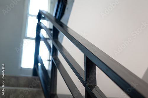 Schilderij op canvas Close-up at stairway iron handrail banister of the high rise building place