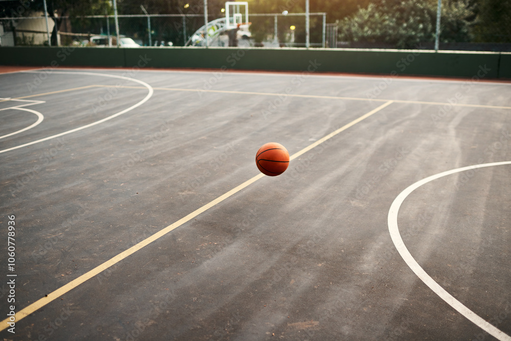 Basketball ball, game and empty court for outdoor competition, fitness and play on college campus. Bounce, asphalt and sports playground space for match, activity and practice ground at athletic club Basketball ball, game and empty court for outdoor competition, fitness and play on college campus. Bounce, asphalt and sports playground space for match, activity and practice ground at athletic club