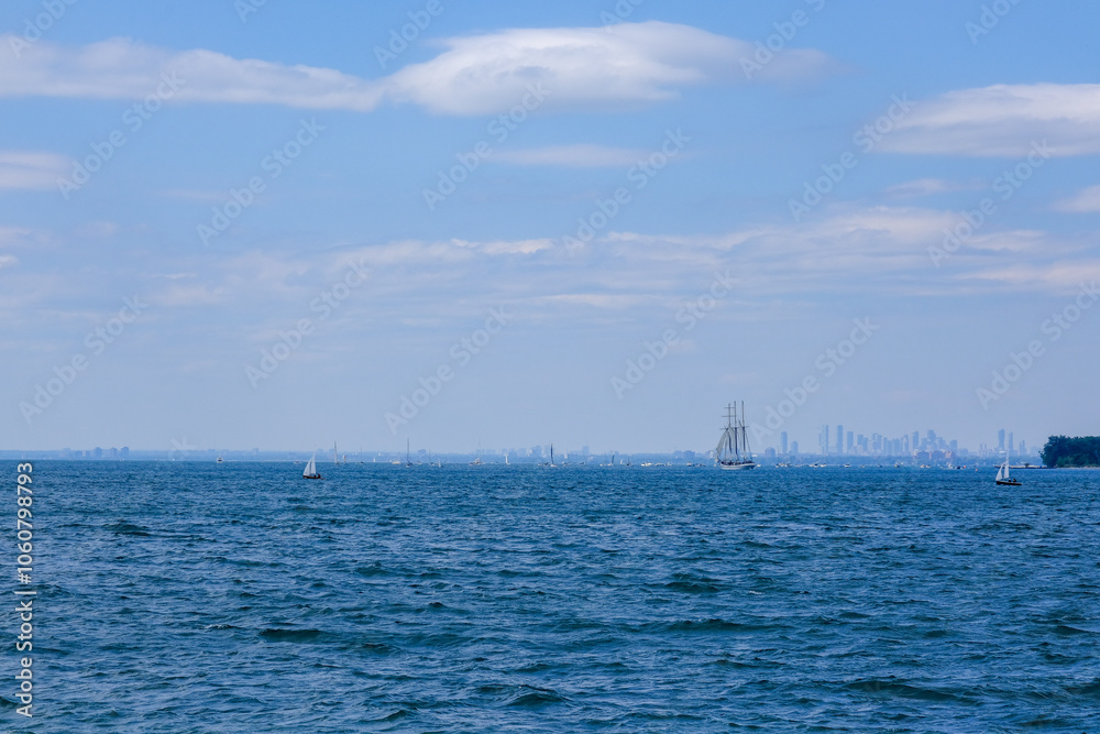 Lake Ontario with lots of boats with Mississauga downtown and skyscrapers at distance Lake Ontario with lots of boats with Mississauga downtown and skyscrapers at distance