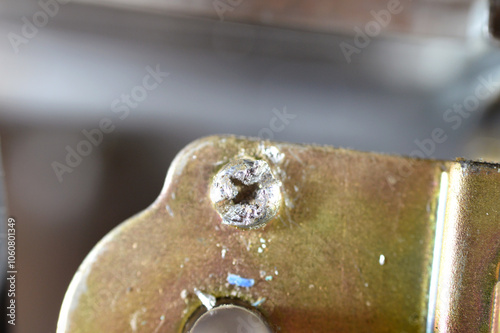 Damaged screw head, Stripped screws, stripped screw is one in which the slots in the head of a screw have worn out, that makes it hard for a screwdriver to grip the screw and turn it, selective focus