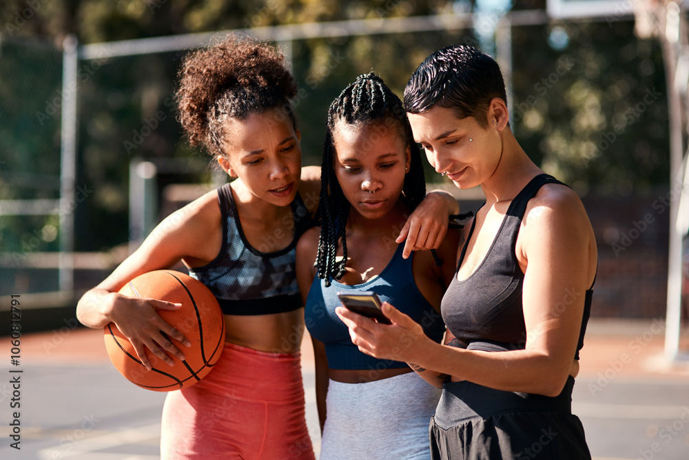 Naklejka premium Basketball, friends and women with phone for sports schedule, social media or show results on chat app. Mobile, ball or group of girls outdoor on break after training, fitness or online game on court