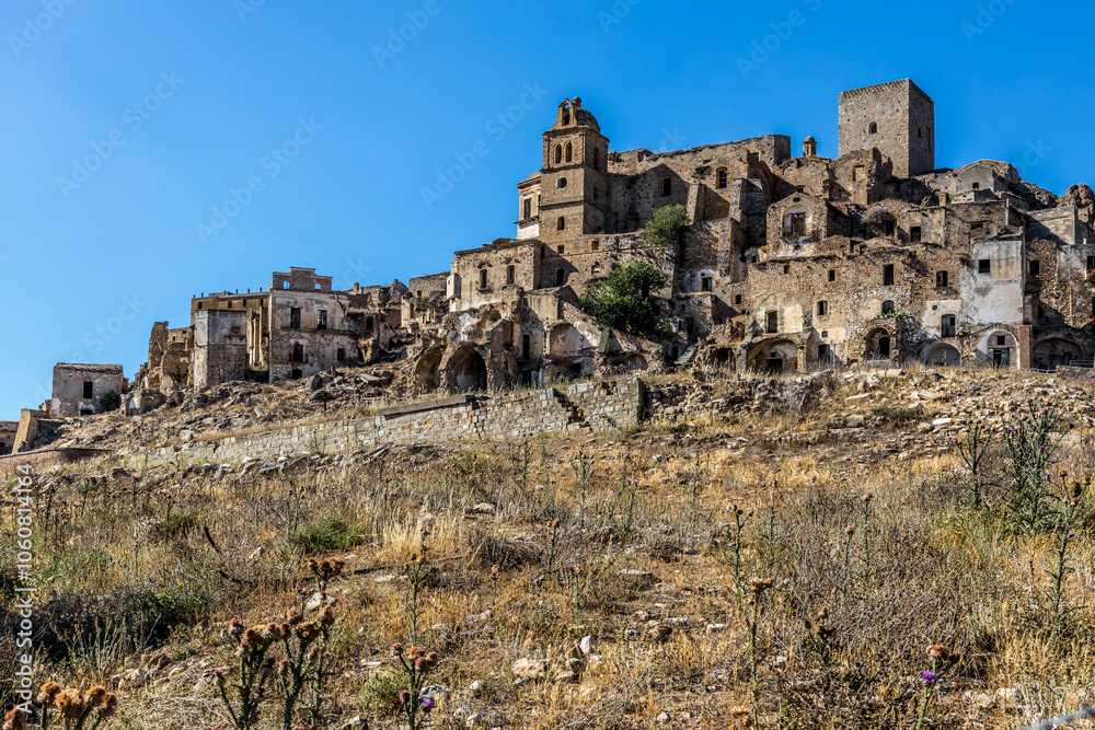 Abandoned ruins of the ghost town of Craco. A city abandoned due to an earthquake in the late 20th century. Province of Matera, Basilicata, Italy