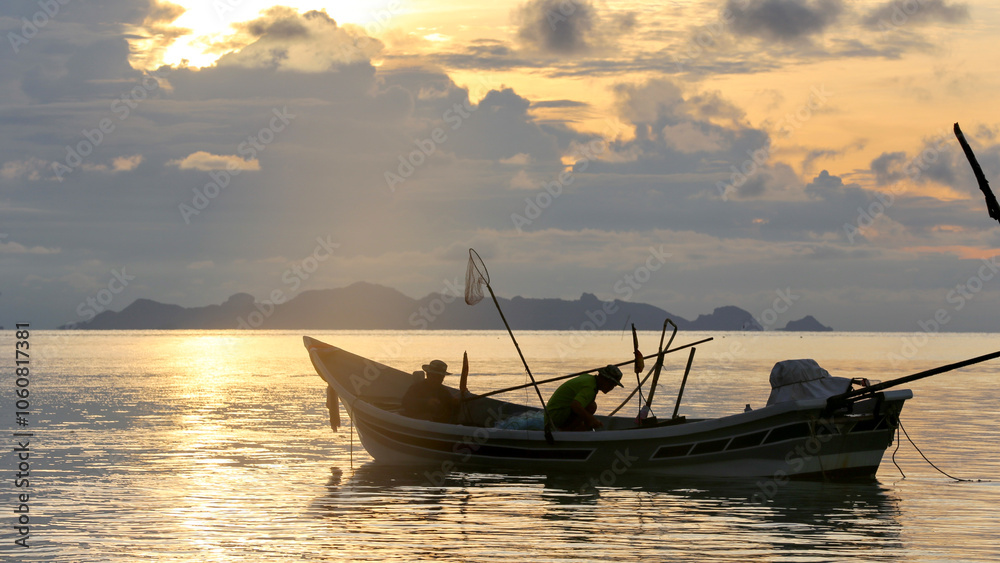 Tranquil Sea at Sunset with Squid Fishing Boat in Action
