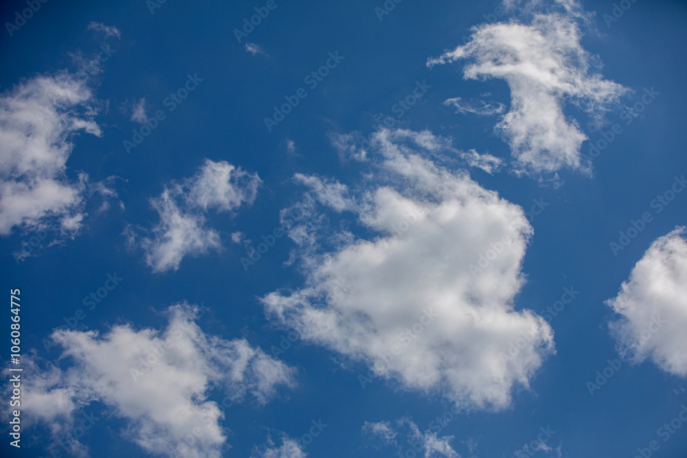 Beautifully Scattered White Clouds Drifting Against a Deep and Expansive Blue Sky Beautifully Scattered White Clouds Drifting Against a Deep and Expansive Blue Sky