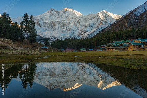 Stunning reflection of Nanga Parbat, the world's ninth-highest mountain, captured in a pristine alpine lake at Fairy Meadows National Park, Gilgit-Baltistan, Pakistan.