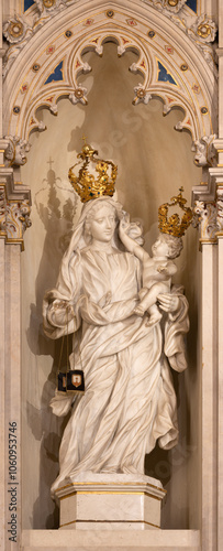 PAVIA, ITALY - SEPTEMBER 8, 2024: The marble statue of Madonna of Scapular in the church Chiesa di Santa Maria del Carmine by scultore Sassi from begin of 20. cent.