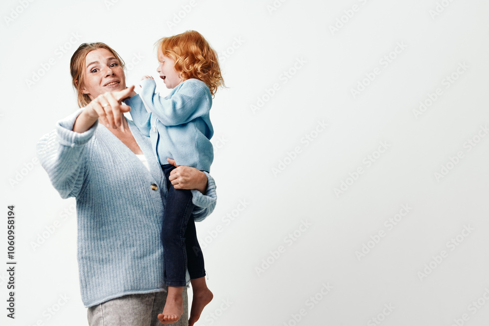 Mother pointing out something to daughter during travel adventure on white background Mother pointing out something to daughter during travel adventure on white background