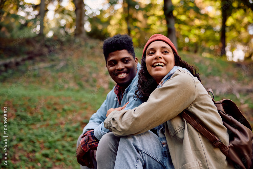 Happy multiracial couple spending an autumn day in nature. Happy multiracial couple spending an autumn day in nature.