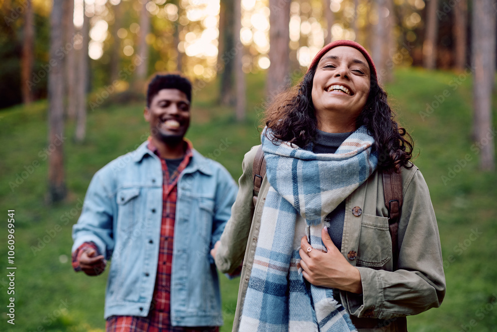 Carefree woman walking with her boyfriend in nature during autumn. Carefree woman walking with her boyfriend in nature during autumn.