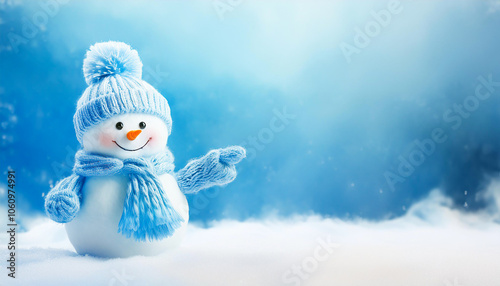little knitted snowman in the snow in dreamy winter landscape pointed to copy space	 photo