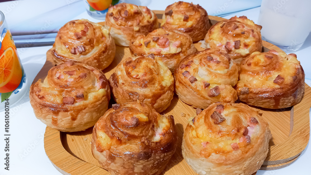 Puff pastry buns baked with sausage and cheese Puff pastry buns baked with sausage and cheese
