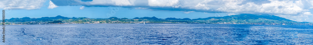 A panorama view along the coastline of the island of San Miguel in the Azores in summertime A panorama view along the coastline of the island of San Miguel in the Azores in summertime
