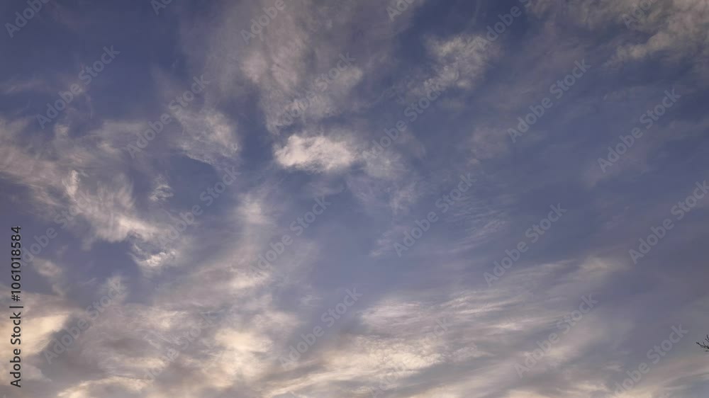 Majestic cloud formations fill the sky during a beautiful sunset in the countryside Majestic cloud formations fill the sky during a beautiful sunset in the countryside