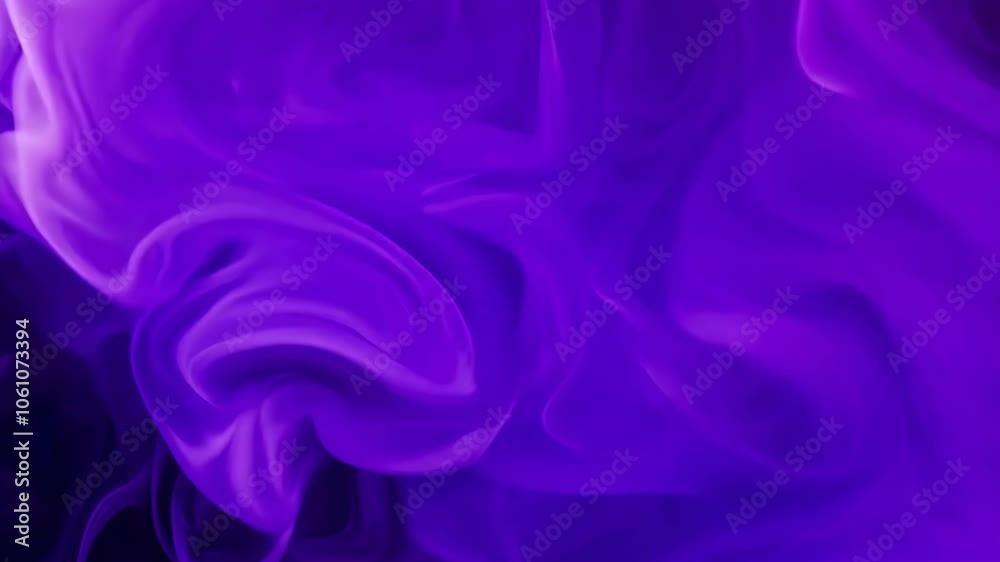 Abstract close-up of purple ink swirling in water, creating fluid shapes and gradients, showcasing vibrant colors and artistic movement. Abstract close-up of purple ink swirling in water, creating fluid shapes and gradients, showcasing vibrant colors and artistic movement.