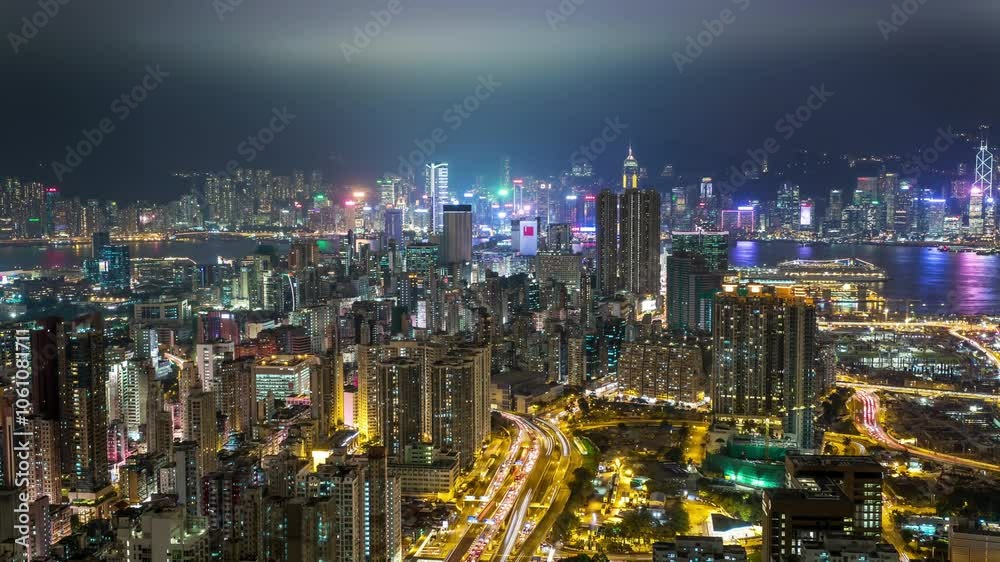 HONG KONG, - OCTOBER 27, 2024: Captivating night skyline views from a rooftop in Hong Kong showcasing vibrant city lights and bustling activity HONG KONG, - OCTOBER 27, 2024: Captivating night skyline views from a rooftop in Hong Kong showcasing vibrant city lights and bustling activity