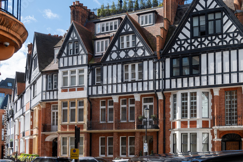 Red bricks houses on Hans Crescent street in Royal Borough of Kensington and Chelsea, London, UK photo