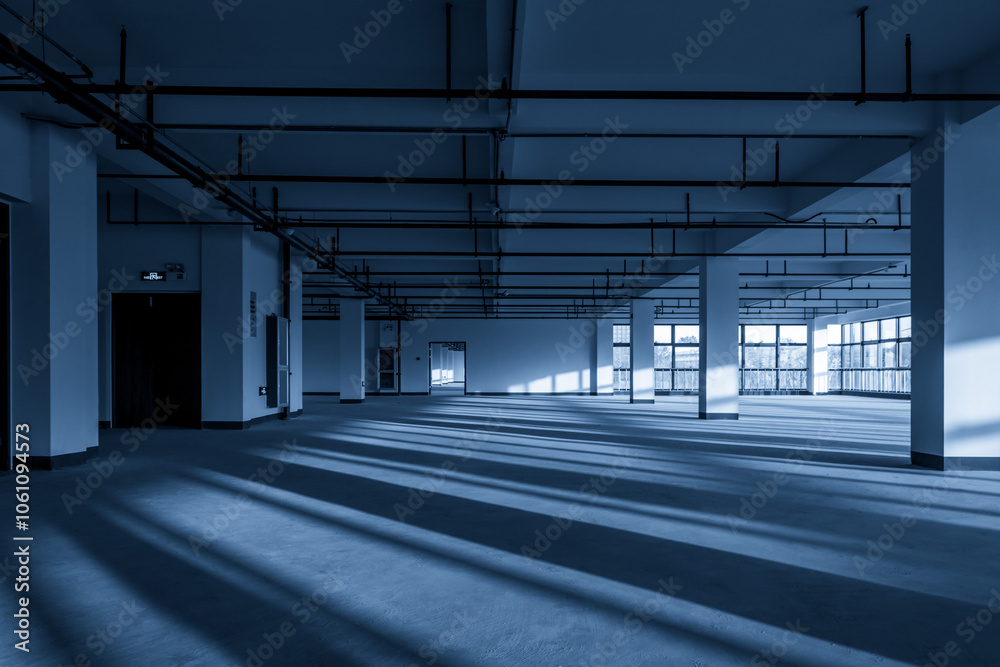 Spacious Commercial Interior with Dramatic Shadows and Natural Light Spacious Commercial Interior with Dramatic Shadows and Natural Light