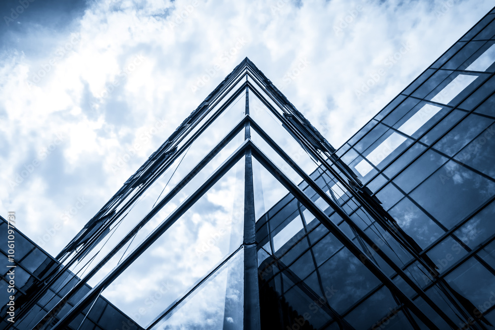 Modern Urban Architecture with Glass Facades and Dramatic Sky Modern Urban Architecture with Glass Facades and Dramatic Sky