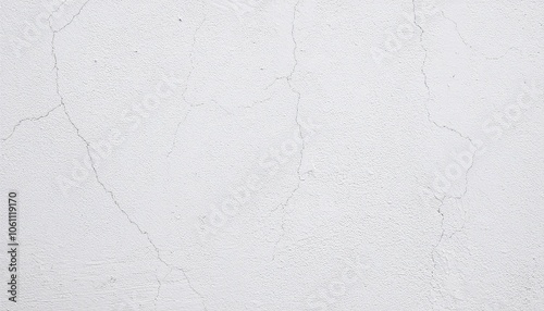 a wall with a white wall texture that shows cracks and peeling paint