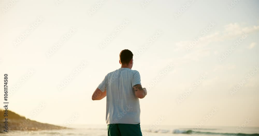 Man, fitness and stretching with back on beach for breathing exercise, warm up or outdoor workout in nature. Male person, yogi or zen with sunset for balance, health and wellness on ocean coast Man, fitness and stretching with back on beach for breathing exercise, warm up or outdoor workout in nature. Male person, yogi or zen with sunset for balance, health and wellness on ocean coast
