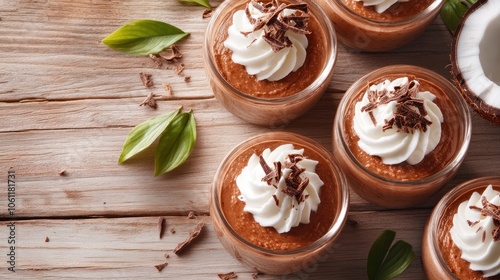 Delicious chocolate mousse desserts topped with whipped cream and chocolate shavings.