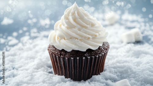 A decadent chocolate cupcake topped with creamy frosting, surrounded by a snowy backdrop.