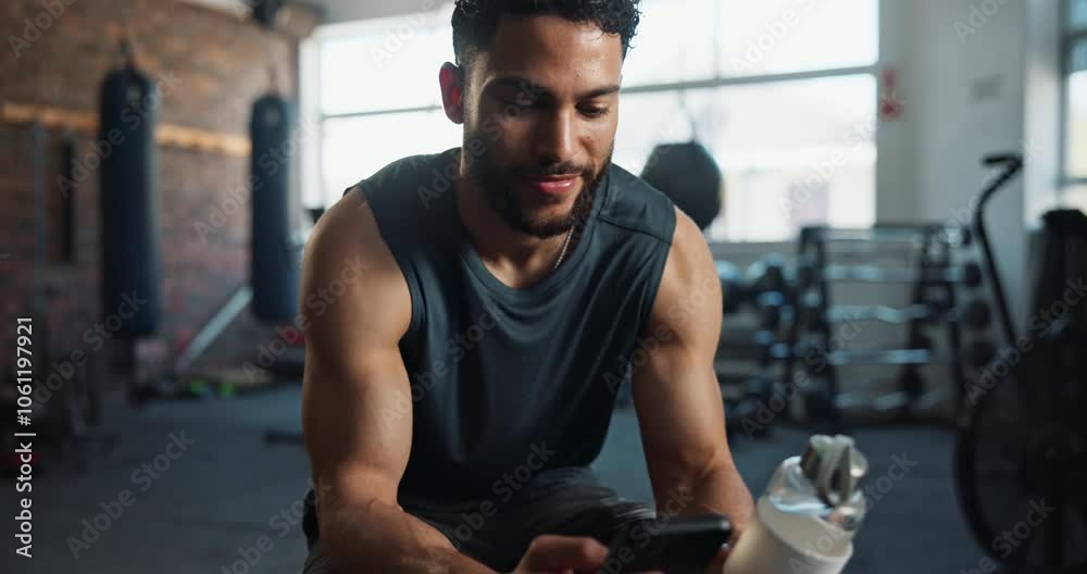 Man, gym and smile with smartphone for fitness on social media, networking and communication. Male person, body builder and happy on internet for videos, text messages and entertainment on exercise