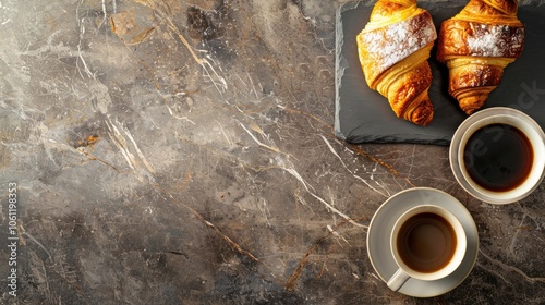 Croissants and coffee on stone surface from above. Ample room for text. photo