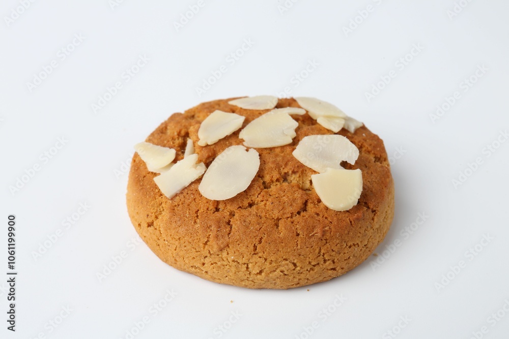 One tasty cookie with almond flakes on white background One tasty cookie with almond flakes on white background