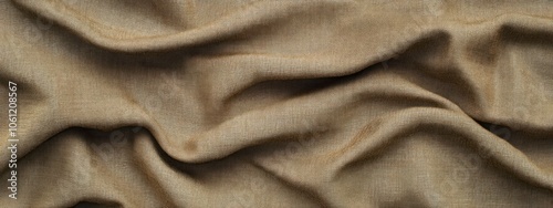 Close-up of crumpled fabric in a warm beige tone, showcasing texture and depth.